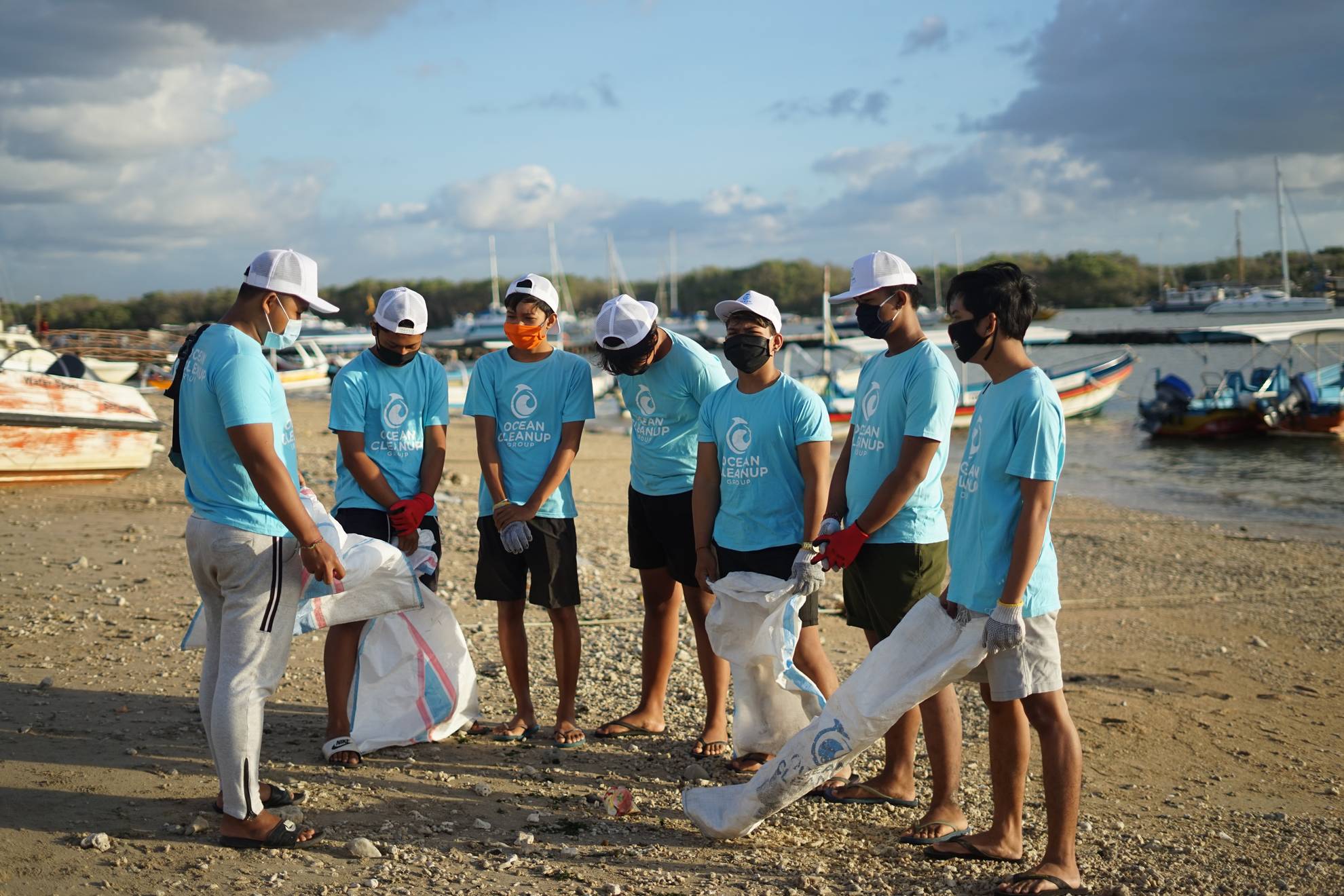 litter pickers on a beach front
