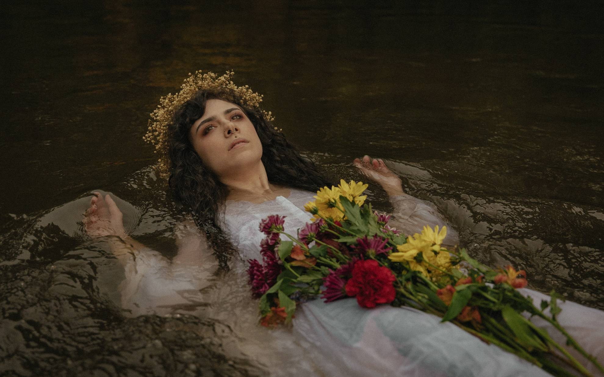 Model lies in river like Ophelia from Shakespeare's Hamlet