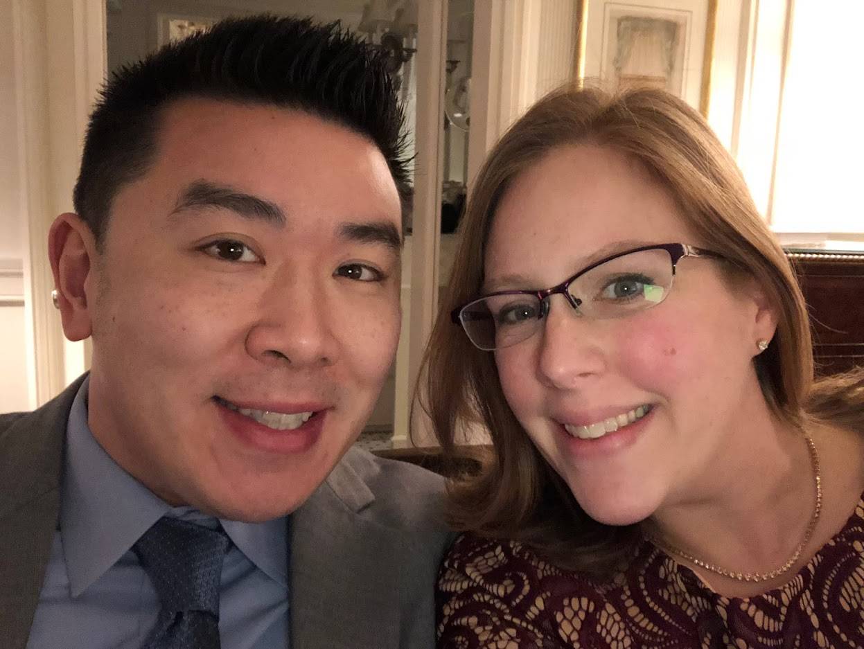 Jim Wang (40) and Martha (40) smile at the camera
