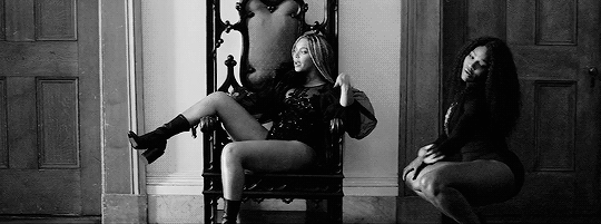 Beyonce sits on a throne and Serena Williams dances next to her