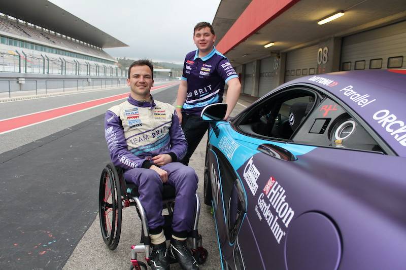 Team BRIT drivers Aaron Morgan and Bobbly Trundley pose by racing car