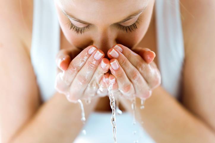 girl washing her face