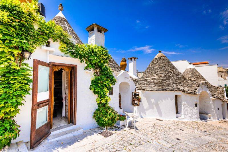 Image of white houses in a street in the village of Puglia in Italy