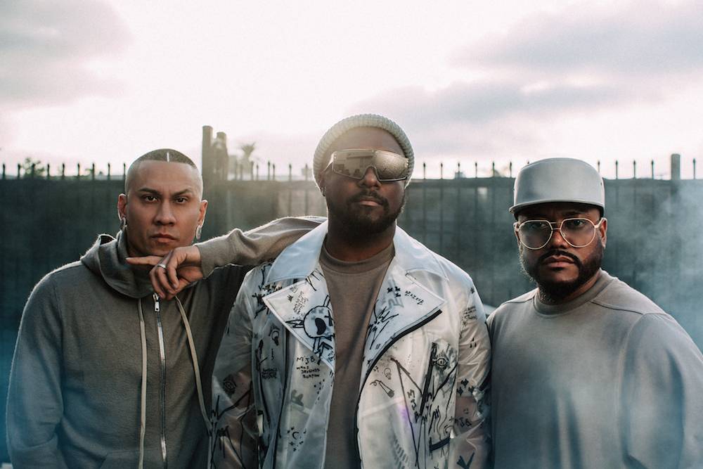 taboo, will.i.am and apl.de.ap look to camera in strong sunshine