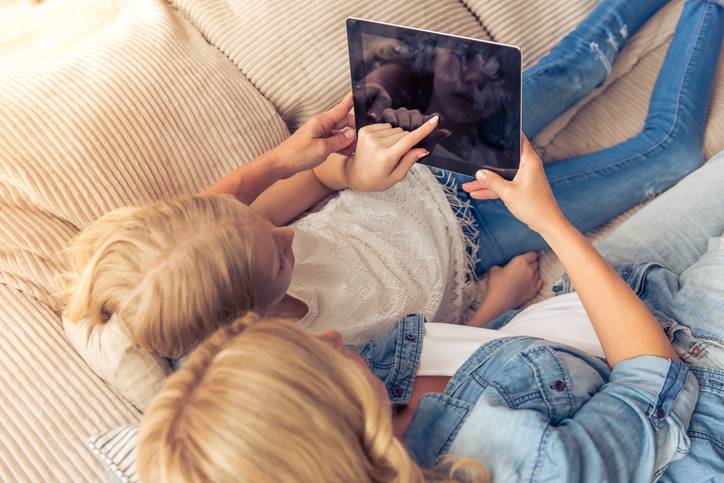 mother and daughter on tablet
