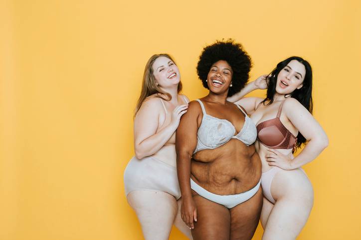 three curvy confident women in lingerie