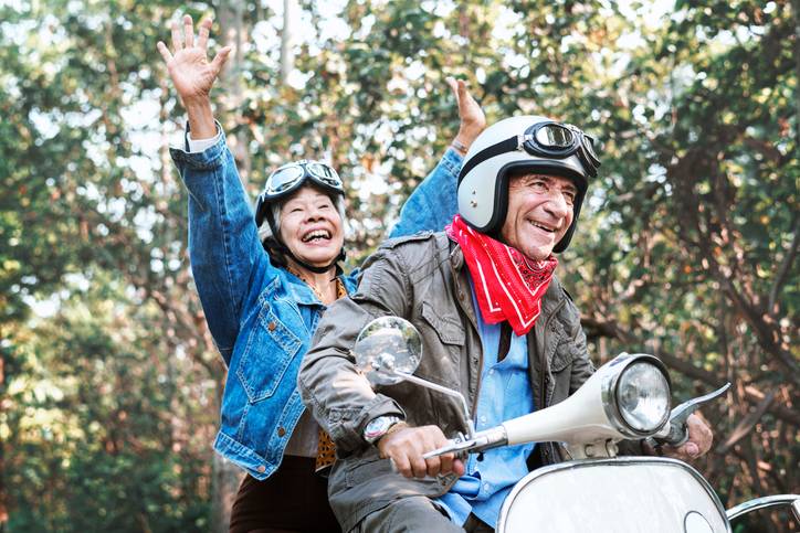 a couple ride a motorbike, recreating their first date for christmas