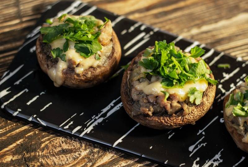 Portobello mushrooms stuffed with melted cheese and herbs