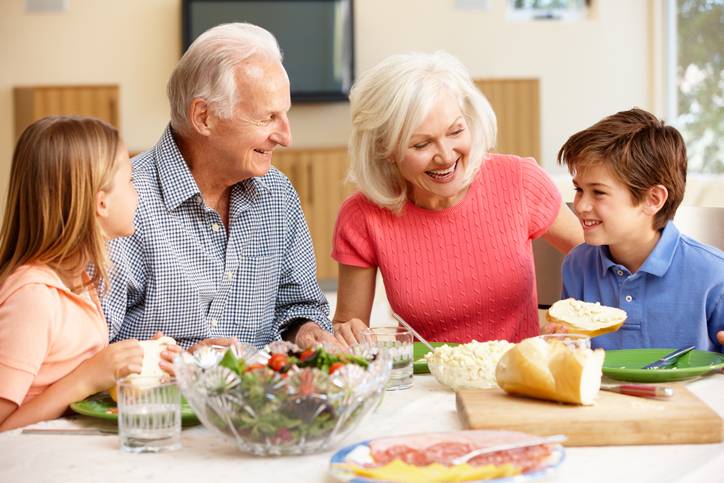 grandparents enjoy a meal with grandchildren
