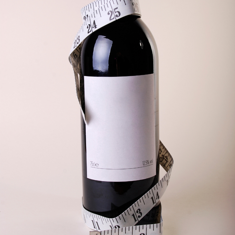 calorie counting tape around a wine bottle