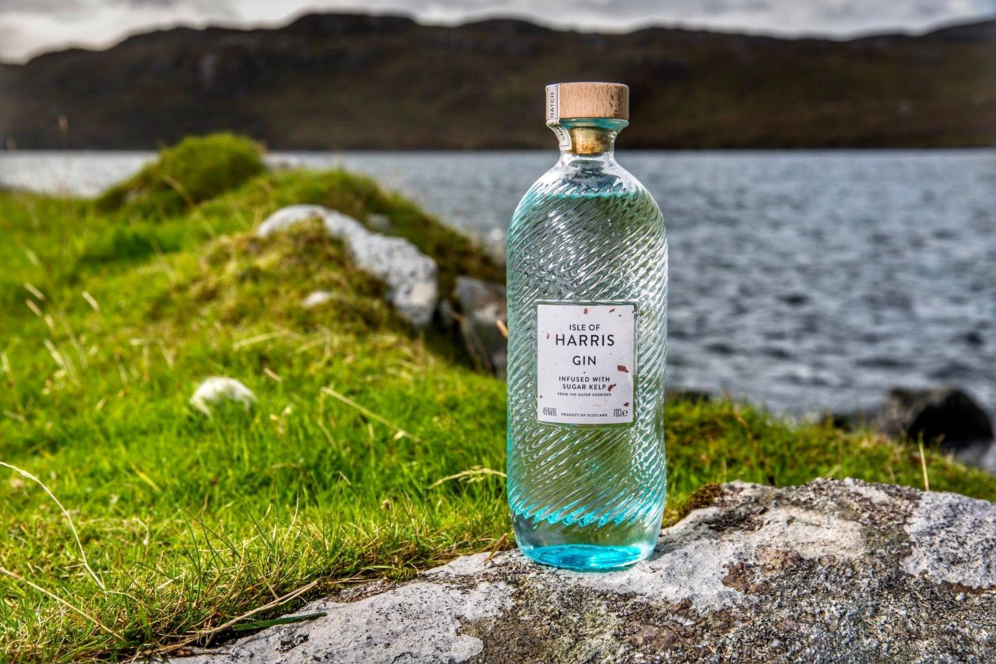 A bottle of Harris gin on the grass