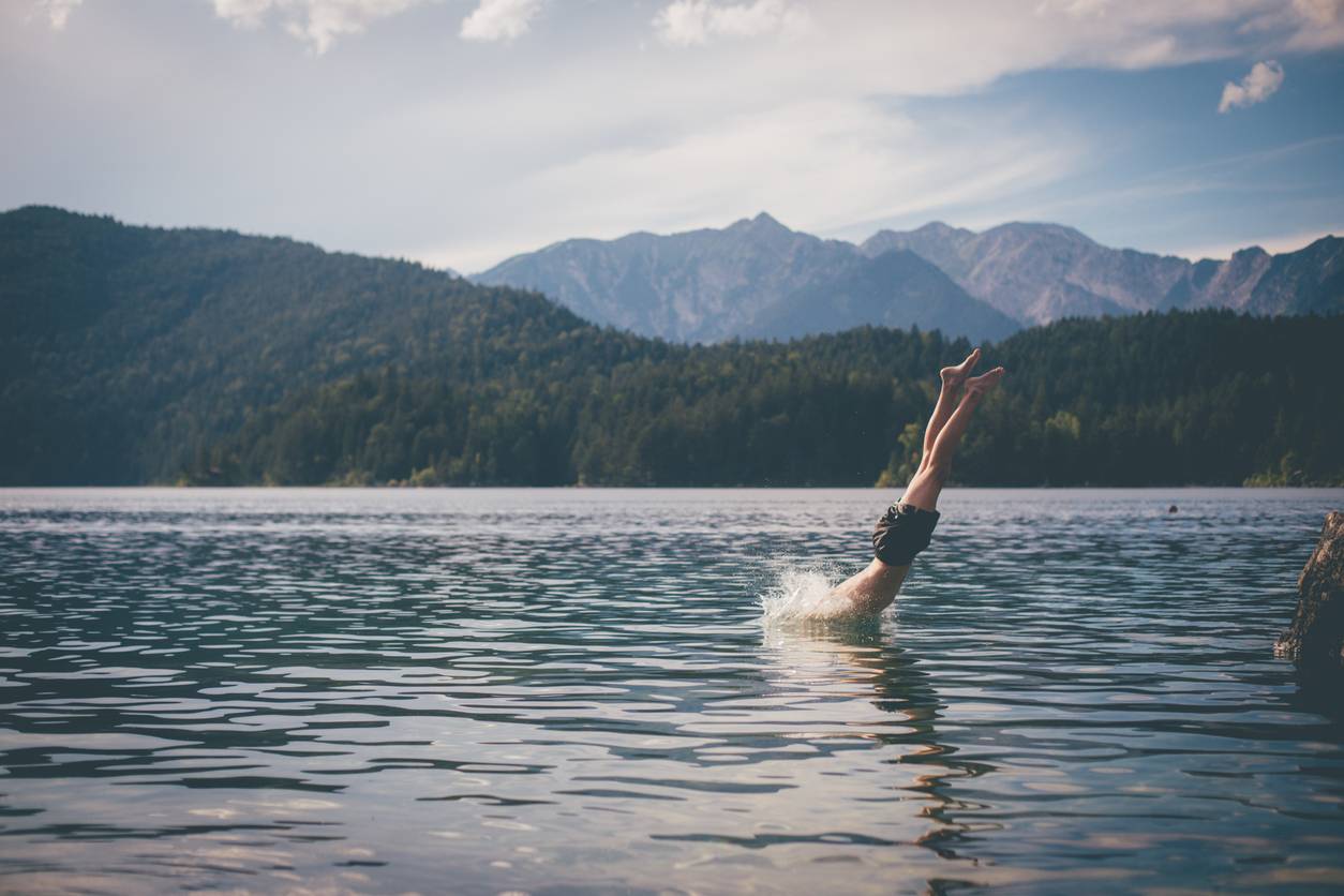 Man diving into wide open lake
